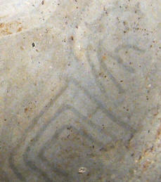 Negative painted images on Cahokia ceramic cup.