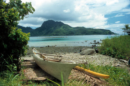 Outrigger canoe on the shore of Samoa in Pacific Ocean.