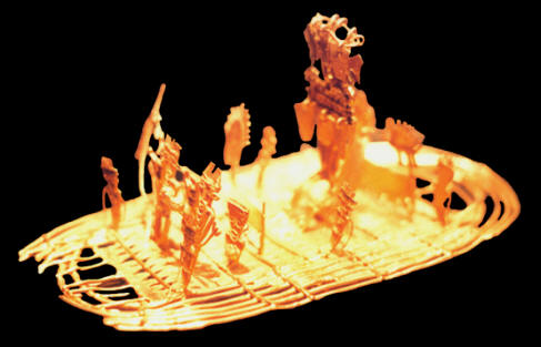 Pre-Columbian gold artifact depicting people on a raft.