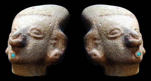 Stone carved heads with labrets from Ecuador.