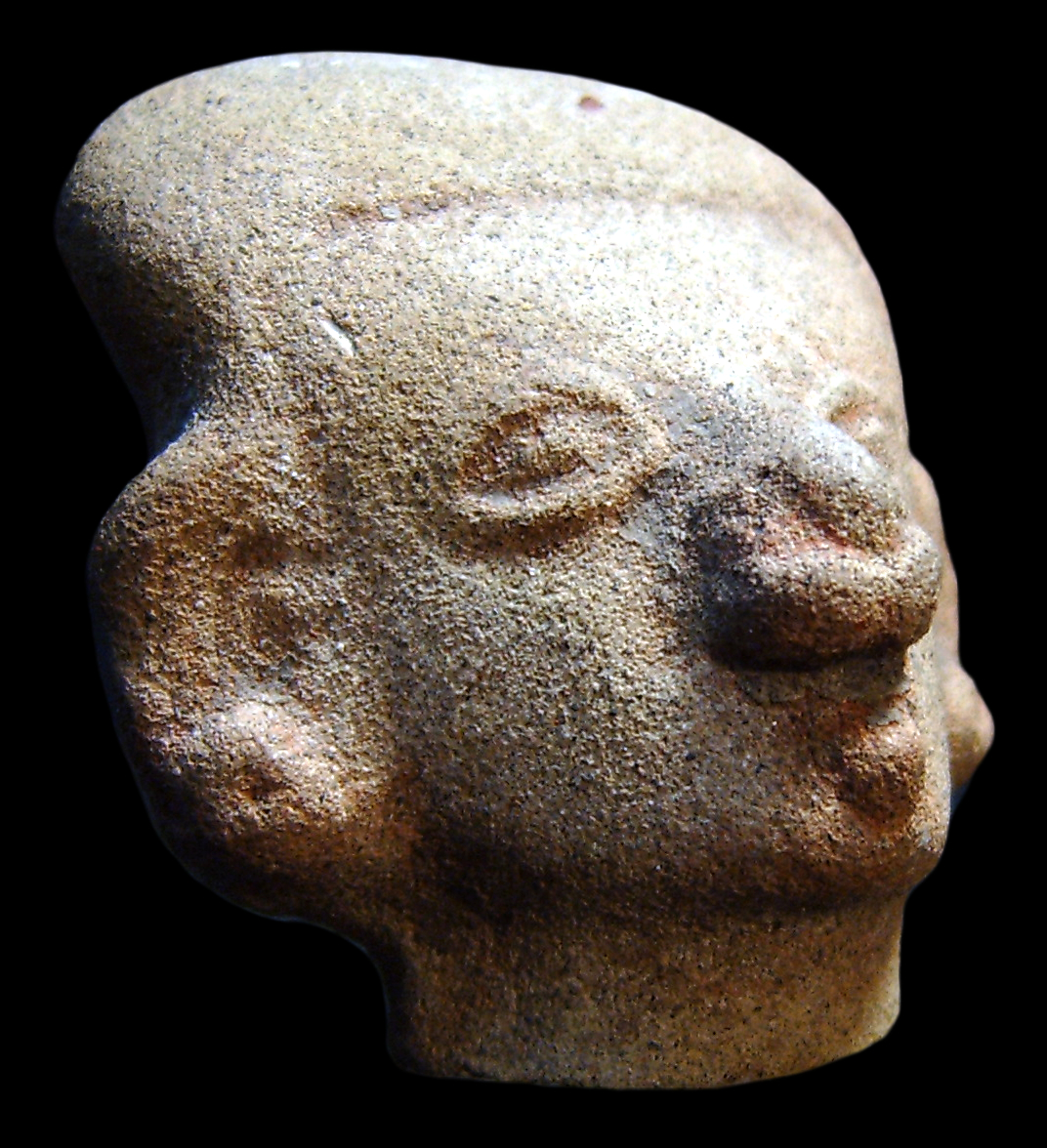 A stone carved head with a labret from Peru.