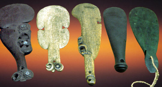 Five examples of Maori short "clubs," in bone, stone, wood.