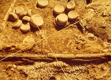 Excavation of mound 72 showing discoidals.