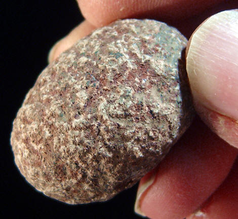 Small stone pestle used to grind hematite.
