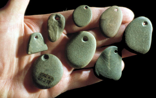 Eight pebble pendants from southern Illinois.