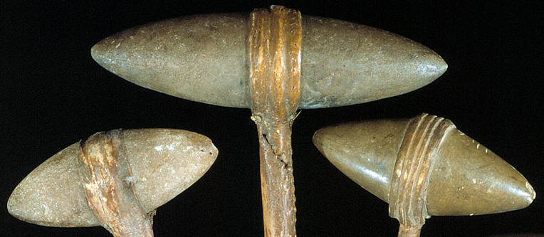 Three double-pointed stone headed plains war clubs.