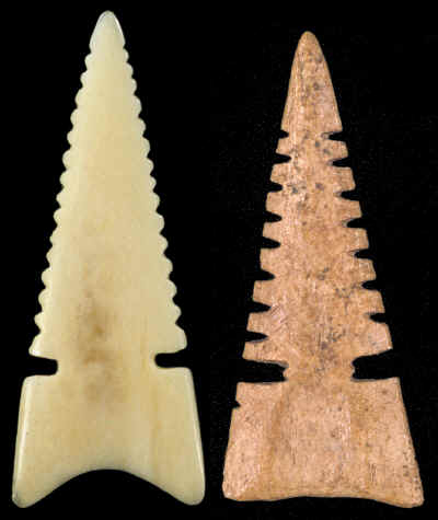 Two double notched serrated bone Cahokia points.