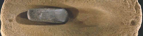 Axe grinding stone with celt (ungrooved axe).