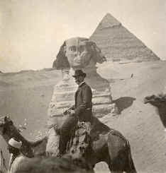 Photo of sphinx and tourist on camel in 1903.