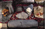 Two bone fishhooks and ceramic rim sherds from the Mitchell site.